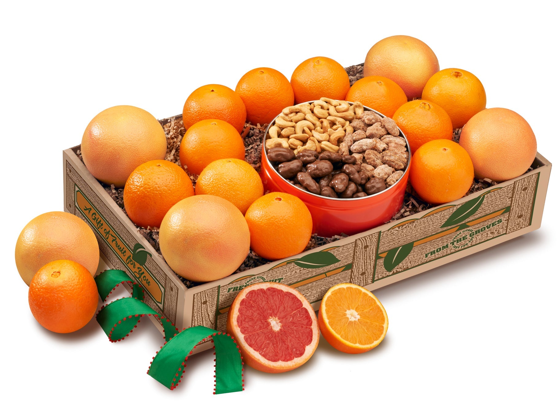 Oranges and grapefruit gift box with red tin of nuts.
