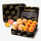 Box of citrus fruits with a 'Thank You!' message on a white background