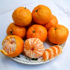 The Satsuma Mandarin arranged on a plate, showcasing their vibrant orange color and sweet, juicy segments.