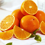 Valencia Oranges whole and cut into pieces.