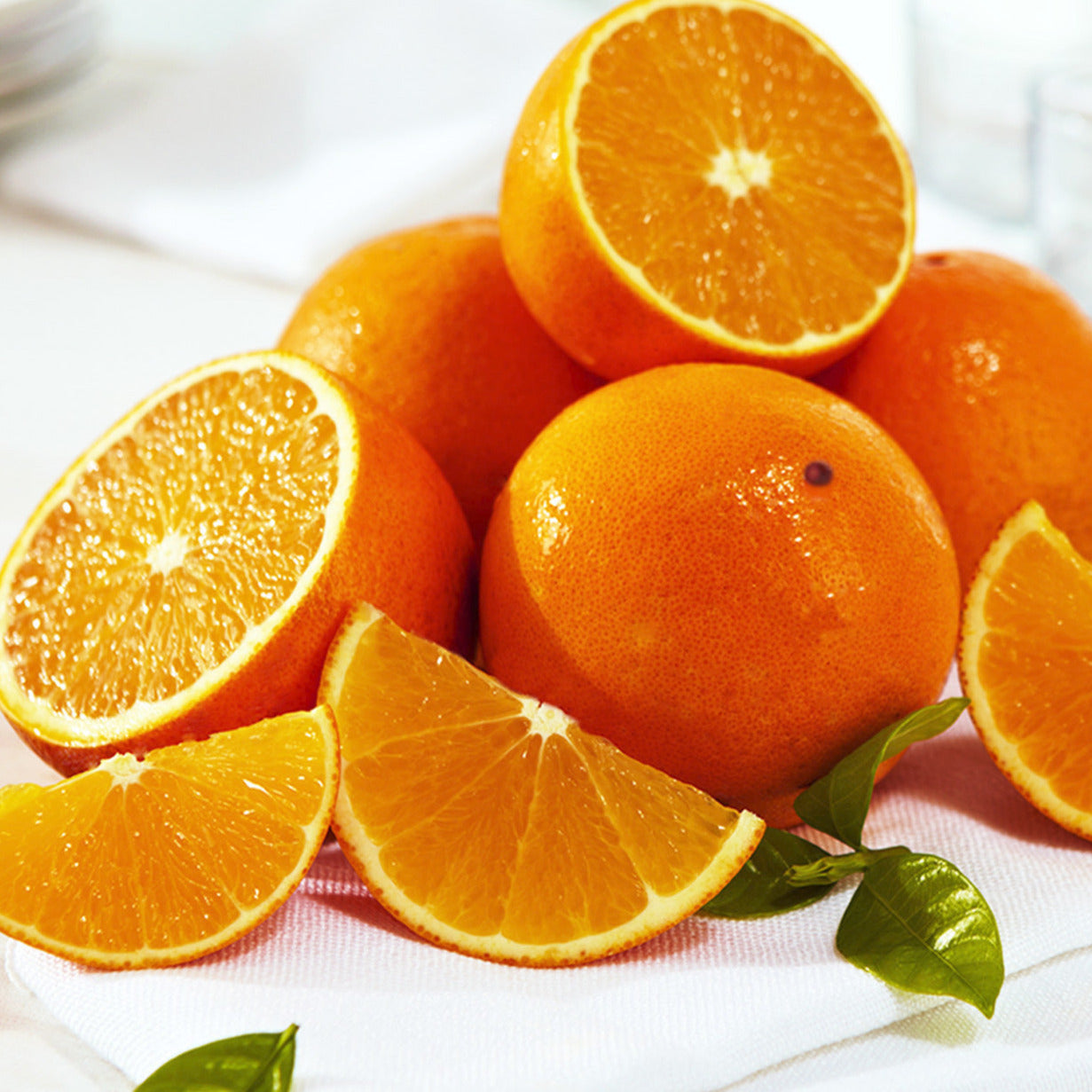 Valencia Oranges whole and cut into pieces.