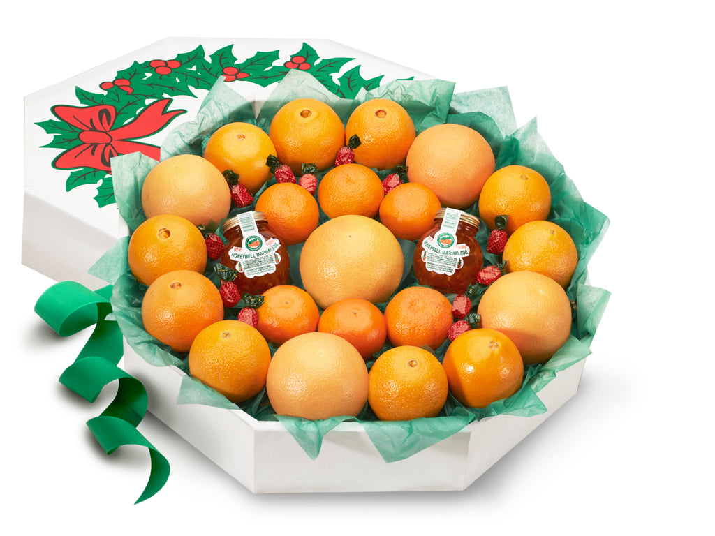 Citrus gift of oranges and grapefruit shaped as a holiday wreath.